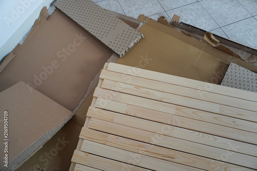 Assembling a children's bed. Furniture parts. New furniture unpacking. Assembling furniture at home. DIY concept with detailed view of furniture installation process.