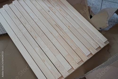 Assembling a children's bed. Furniture parts. New furniture unpacking. Assembling furniture at home. DIY concept with detailed view of furniture installation process.