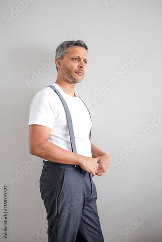 Contemplative Mature Man in Side Profile, Hands Clasped