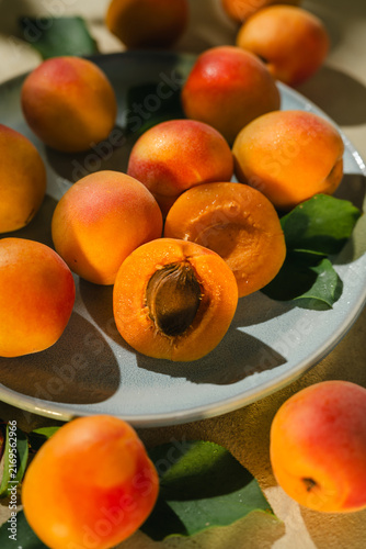 Фотография Fresh apricot fruits, healthy summer food. Sunlight summer vibe