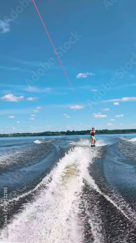 Athletic girl wakeboarding, healthy active lifestyle, water fitness and outdoor sports, young woman staying fit and active