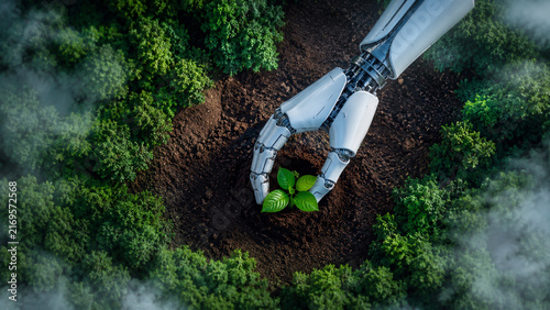 A sleek robotic arm gently cradles a vibrant green seedling planted in rich brown soil, surrounded by a lush forest canopy viewed from above through drifting mist, symbolizing technology serving.