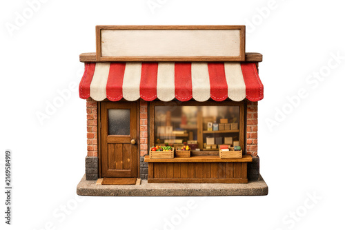 Small wooden produce shop front with striped awning