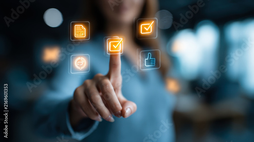 Woman interacts with digital checklist and apps in an office setting showing technology and user experience