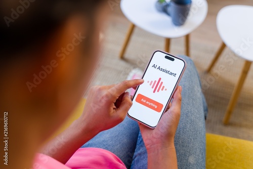 A Hispanic person using an ai assistant on a smartphone