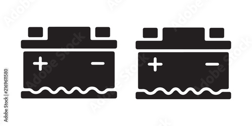 Foto Two black car battery icons with plus and minus terminals and wavy base detail