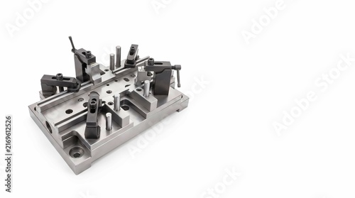 Precision machined metal industrial fixture jig with steel clamps and alignment pins for high quality manufacturing processes on white background