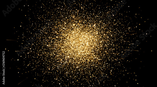 Abstract Golden Dust Particles Explosion Isolated on Dark Black Background