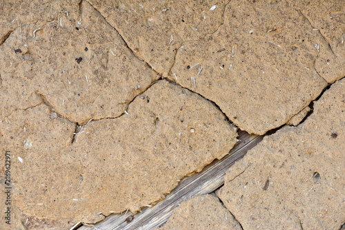 Fotografie old plaster on the wall, cement, adhesive for screed
