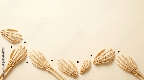Minimalist background with decorative wheat stalks and black peppercorns arranged on a soft beige surface