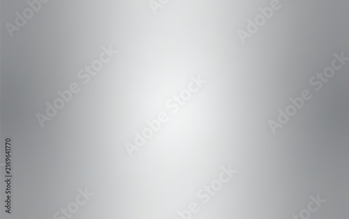 Abstract silver gradient background with a soft grey metallic texture and radial white light spotlight effect in the center for elegant modern graphic minimalist designs.