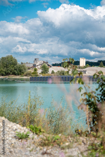 Obraz na plátně Vertical floating solar panels on the Gilching quarry lake in Bavaria, Germany,