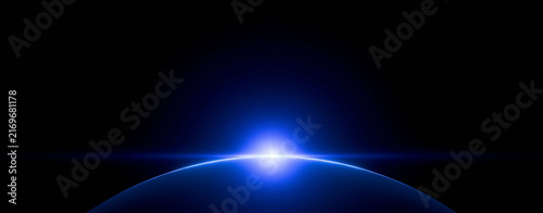 Blue glow rises over dark curve of Earth