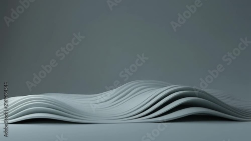 Flowing White Paper Sheets Creating Elegant Wave Pattern on Minimal Gray Background