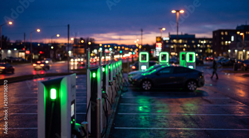 Blurred EV Charging Hub Green LED Bokeh