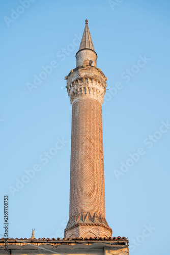 Картината върху платно Ottoman brick minaret against clear blue sky