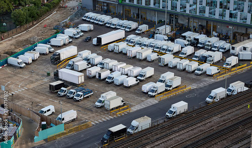 Foto Logistics warehouse yard with delivery trucks and commercial vehicles for distribution operations