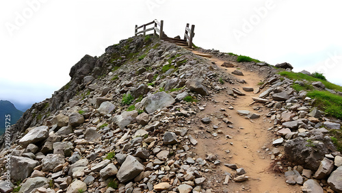 Difficult narrow mountain trail with loose stones and broken handrail, abandoned hiking path