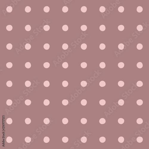 Soft pink polka dots pattern on a muted mauve background
