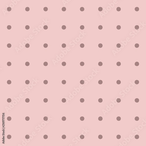 Subtle polka dot pattern on a soft pink background for design