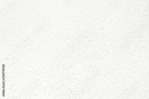 White stucco wall texture background with rough plaster surface