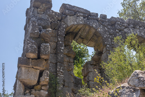 The ruins of Termessos. An ancient megalithic structure in Turkey. Ancient buildings of previous civilizations. Arches made of megalithic stone blocks.