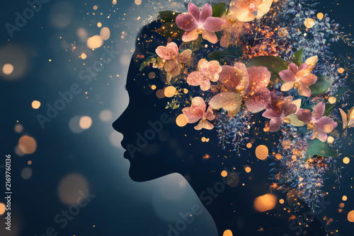A woman's head silhouette merges with cascading orchids, tulips, and wisteria. The floral explosion beautifully unites human form with nature's vibrant essence.