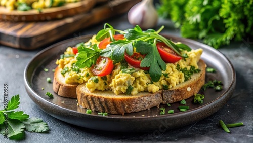 Scrumptious Scrambled Egg and Tomato Open-Faced Sandwich on Toasted Bread with Fresh Herbs