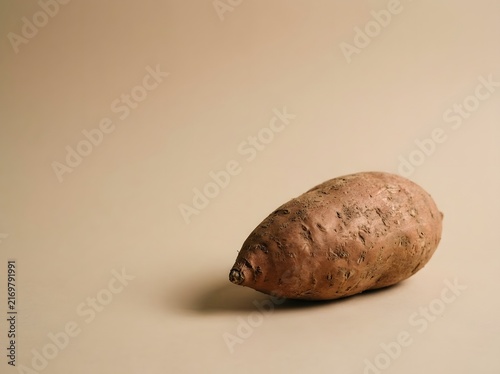 Raw Sweet Potato on a Minimalist Background for Culinary Use