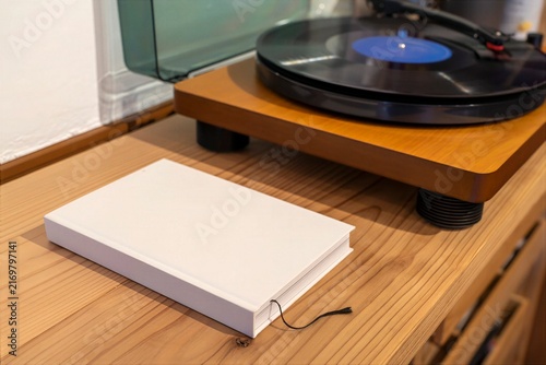 Vinyl Record Player with Blank Notebook in a Minimal Home Interior