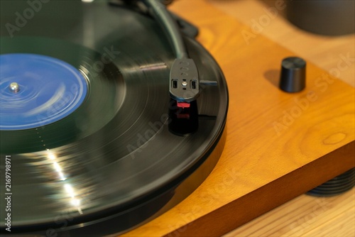 Turntable Cartridge and Stylus Playing a Vinyl Record Close Up