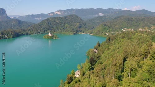 Breathtaking high angle view of Lake Bled, Slovenia, with mountains on a sunny day