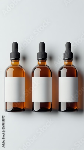 Three amber glass dropper bottles with black pipette caps and blank