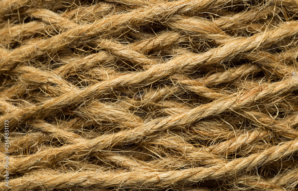 Fototapeta premium Close up of natural jute rope texture background,Macro,Macro close-up shot of rolled natural brown hemp or jute twine rope texture, showing intricate fiber patterns, twisted strands, and rustic.