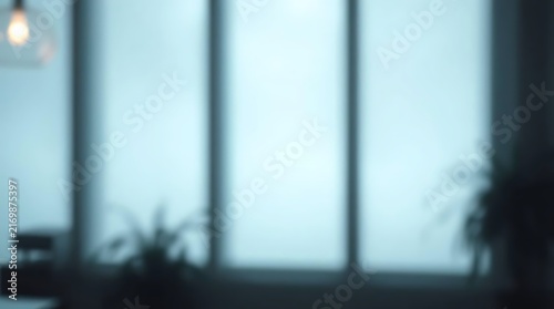A blurry background of an empty office after work hours.