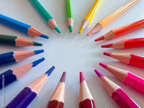  Creative composition of multi-colored pencils forming a circle, art and education concept.