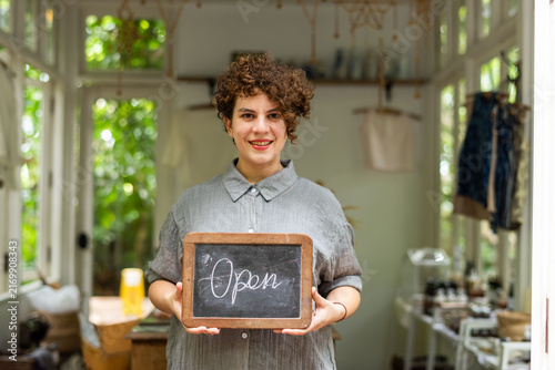 Фотография Welcoming shop owner smiling photo