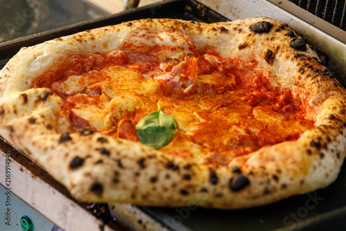 Принти на полотні Close-up of a freshly baked Neapolitan pizza with tomato sauce, mozzarella, papr