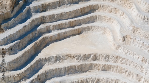 White Stone Quarry with Stepped Terraces and Winding Roads