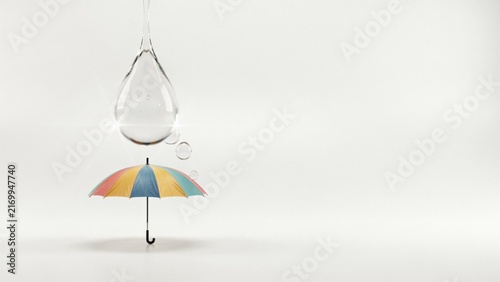 Water Drop with Tiny Umbrella Protection Concept.