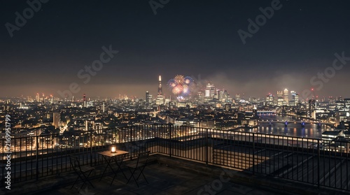 Spectacular Cityscape at Night with Fireworks Display Over Illuminated Skyline ai generated