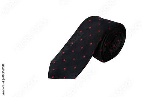 Konstfotografi Rolled Black Silk Necktie with Red Star Pattern Isolated on White Background