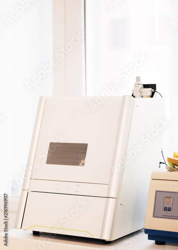 Obraz na płótnie Wet dental milling machine used for CAD CAM production of crowns, bridges, inlays and onlays from glass ceramic and composite resin in a modern dental laboratory