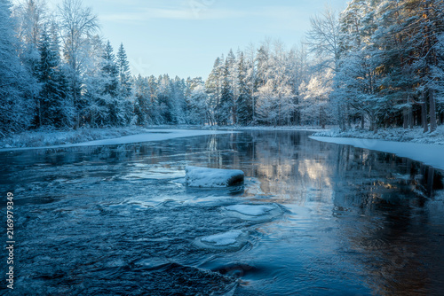 River landscape in a cold morning with snow and frost. Farnebofjarden national park in north of Sweden