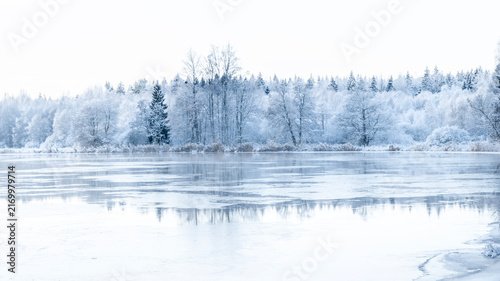 River landscape in a cold morning with snow and frost. Farnebofjarden national park in north of Sweden