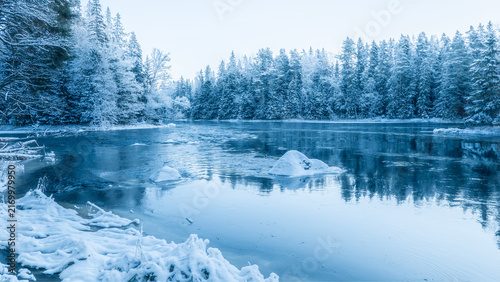 River landscape in a cold morning with snow and frost. Farnebofjarden national park in north of Sweden