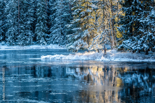 River landscape in a cold morning with snow and frost. Farnebofjarden national park in north of Sweden