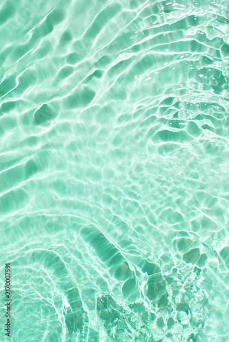 Foto Abstract wave water on a pastel turquoise green background.
