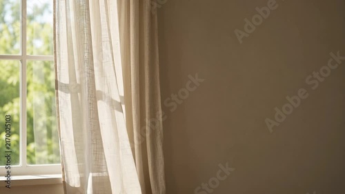 White Curtain Swaying Gently in the Breeze by Sunlit Window with Wide Copy Space, Cozy Home Interior Background