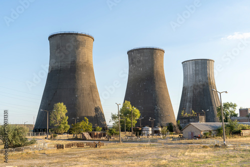 Cuadro en lienzo Concrete cooling towers of an old power plant against a blue sky